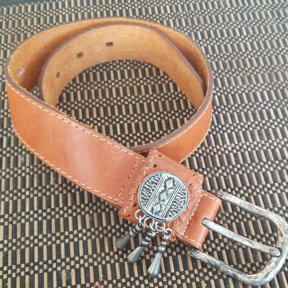 Tan leather belt with decorative buckle